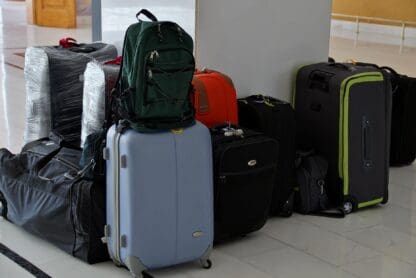 a group of luggage on a white floor