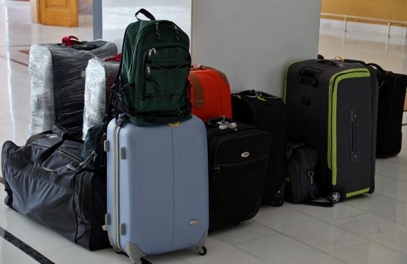 a group of luggage on a white floor