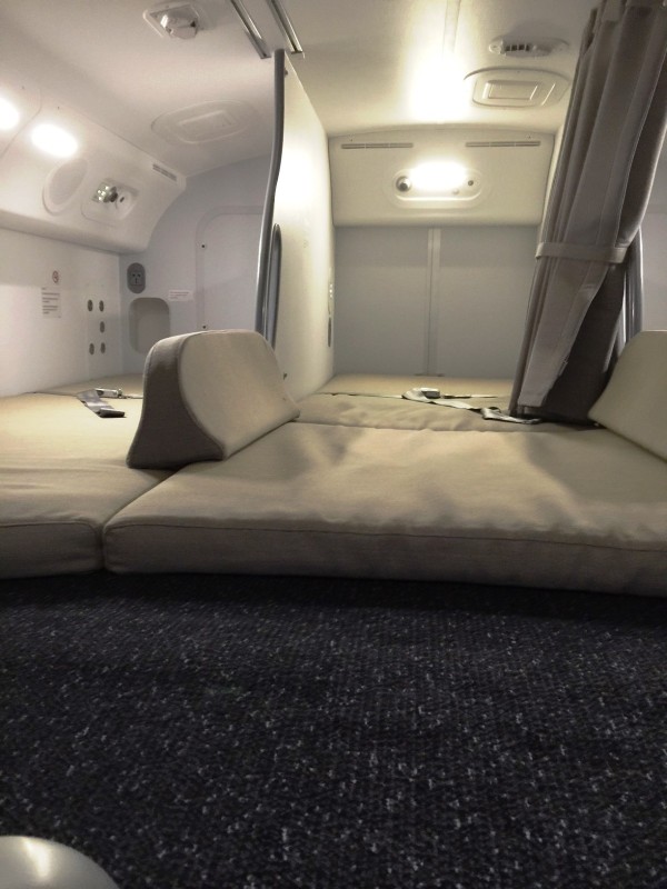 The crew rest area sleeps six on small divided pallets.